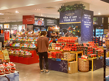 A shopper in M&S in the UK shopping the Christmas assortment