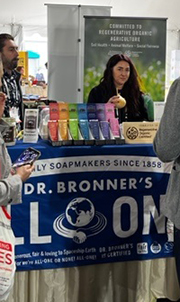 Dr Bronner’s booth featuring their commitment to regenerative organic agriculture