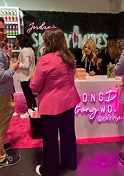 Jordan’s Skinny Mixes booth featuring Magenta Neon