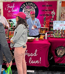 Tia Lupita’s Magenta booth and hats
