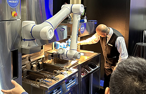 Robotic arm operates a French frier at the National Restaurant Association Show