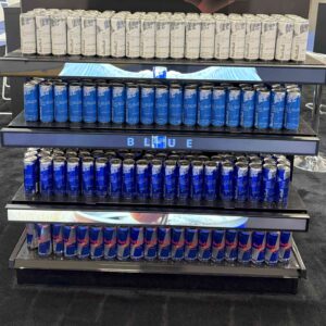 Shelfs of beverages with led shelf strips showing advertisements