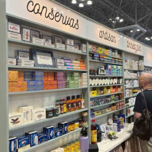 lines of tinned fish on shelves at the Fancy Food tradeshow