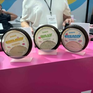 pastel colored font on beige background sitting on a pink tablecloth