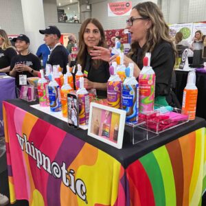 rainbow tablecloth with rainbow bottle of whipped cream